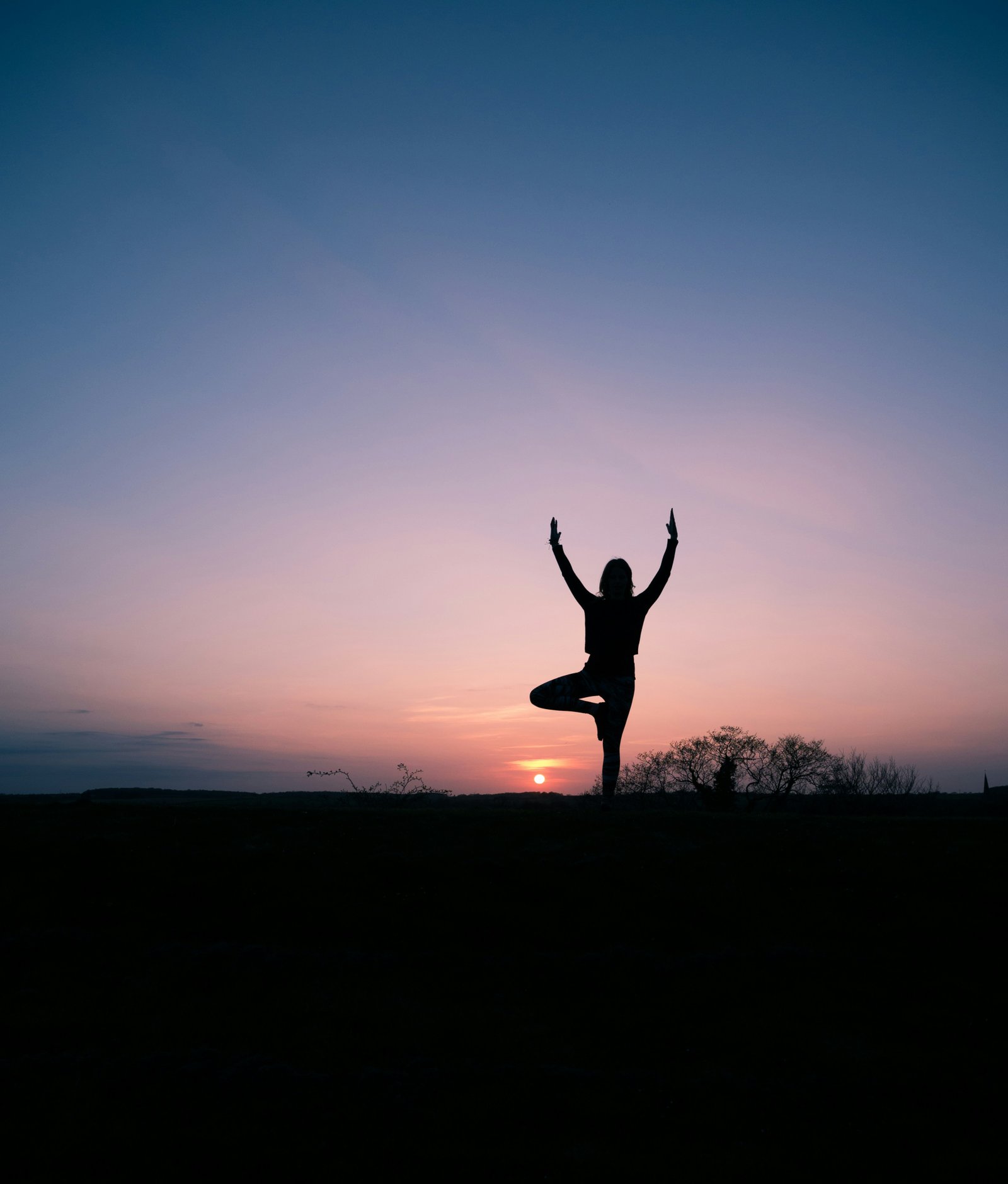Silhouette of a person balancing, still and composed